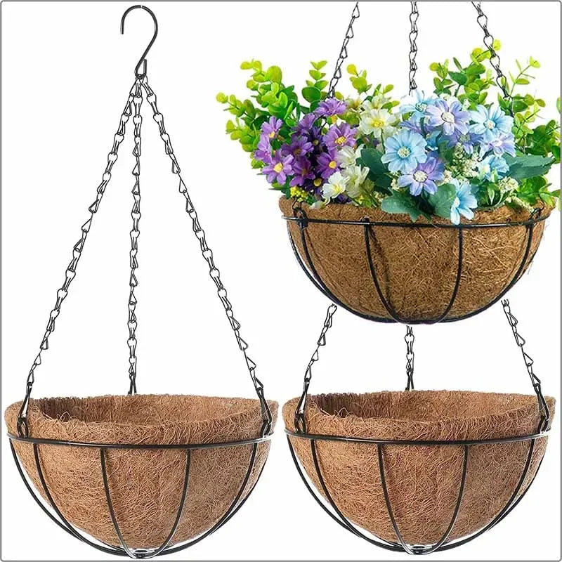Three hanging coconut fiber basket planters with black metal chains, one filled with colorful artificial flowers