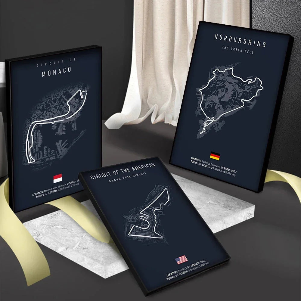 Framed minimalist circuit maps of Monaco, Nürburgring, and Circuit of the Americas displayed on marble stands