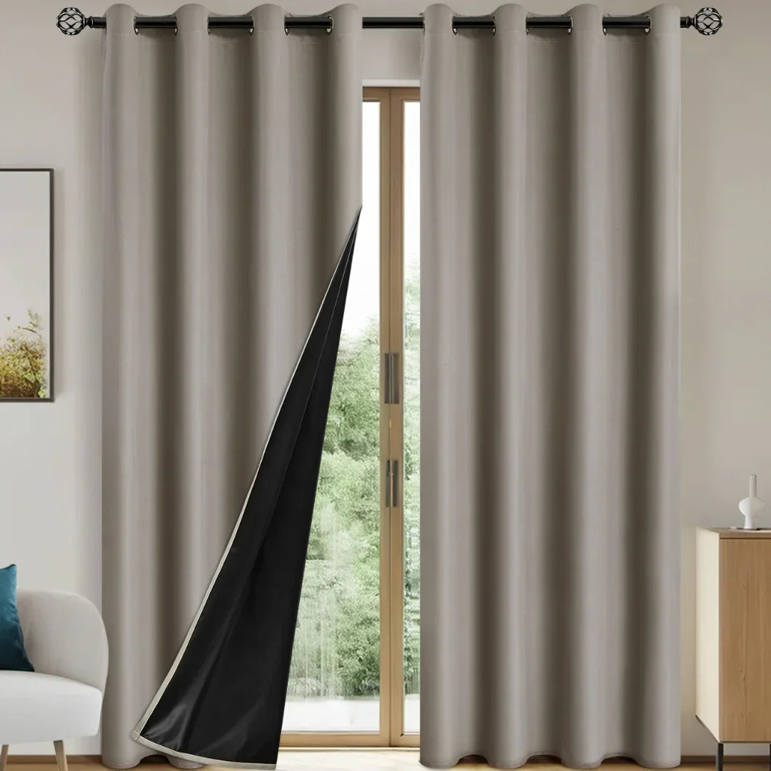 Modern beige blackout curtains with black backing in a cozy living room with glass door and wooden furniture