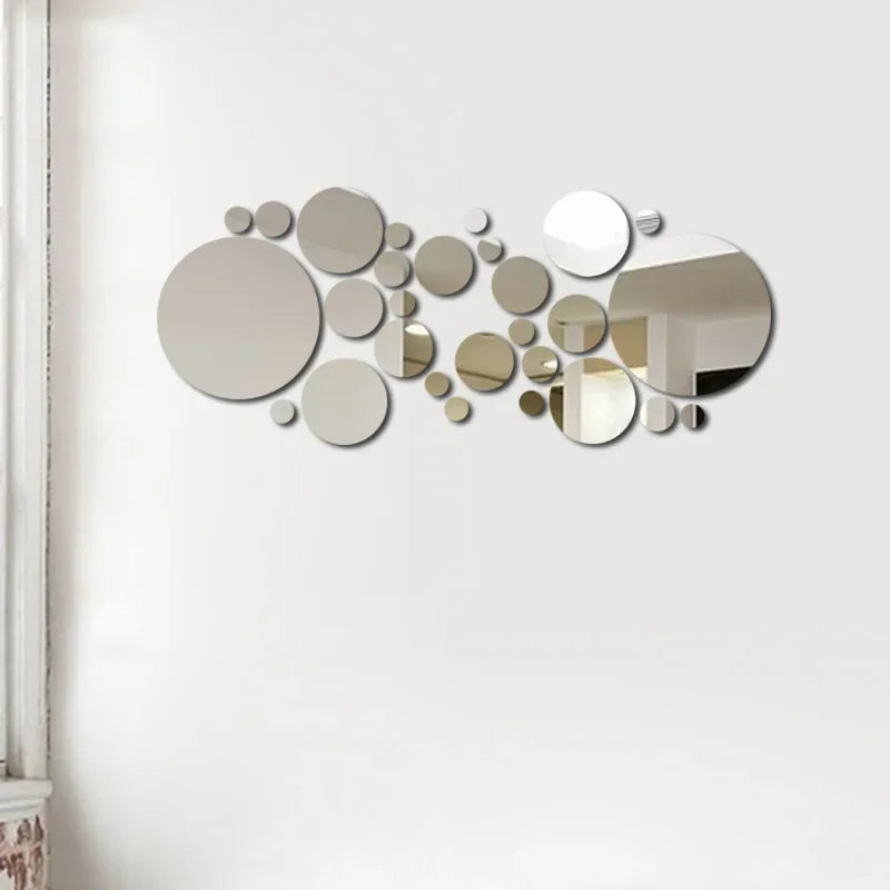 Modern decorative wall mirror made of various sized circular mirrors arranged artistically on white wall