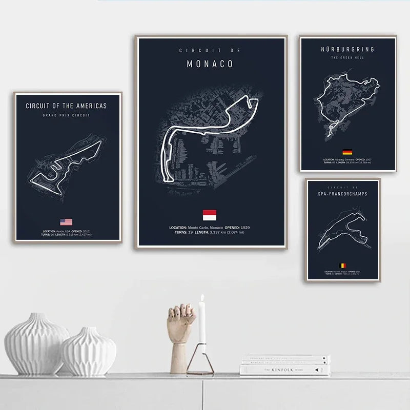 Wall art displaying Formula 1 race track maps of Monaco, Circuit of the Americas, Nürburgring, and Spa-Francorchamps above modern white console with decorative vases and books