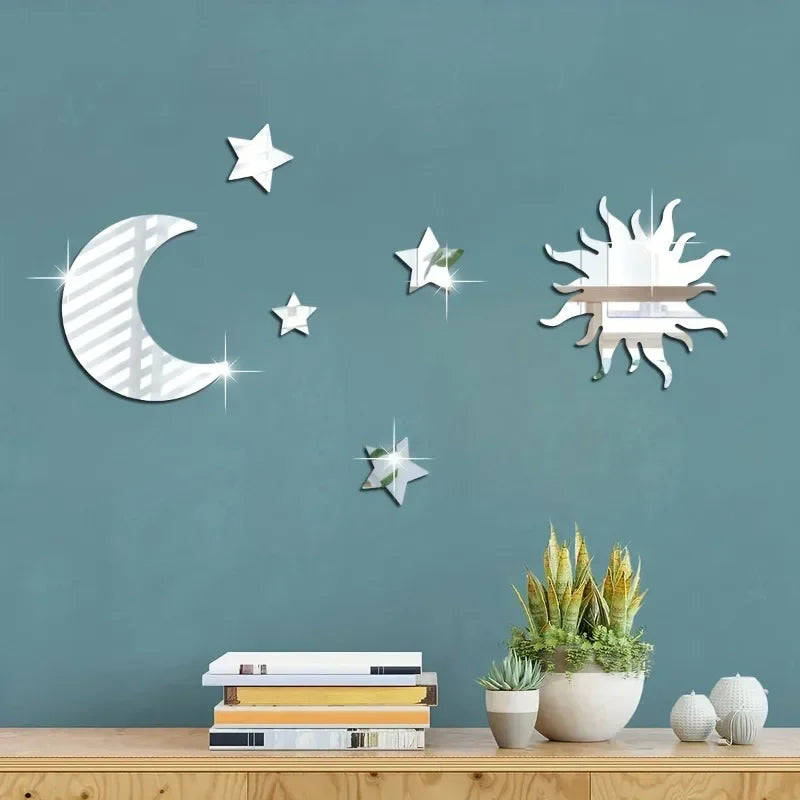 Decorative moon, stars, and sun mirrors on teal wall above wooden shelf with books and potted plants